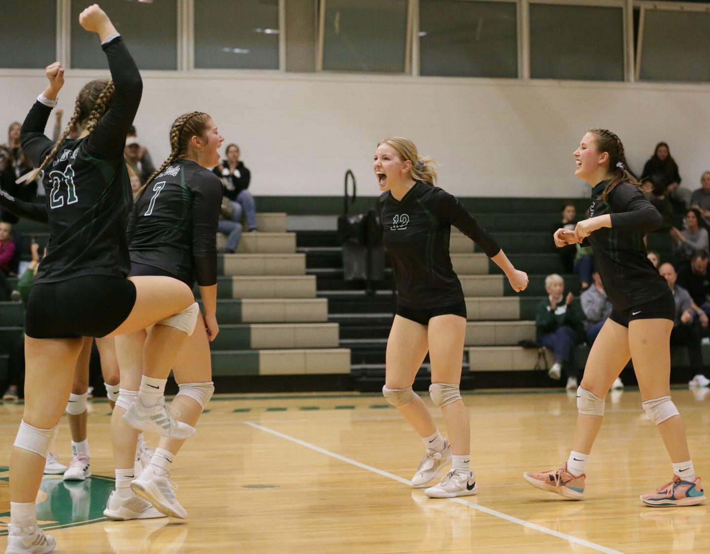 Members of the St. Bede volleyball team celebrate after defeating Henry-Senachwine in the Class 1A semifinal game on Wednesday, Oct. 16, 2022 at St. Bede Academy in Peru.