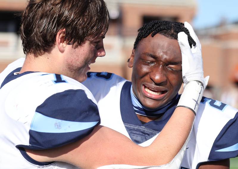 Nazareth's Justin Taylor is overcome with emotion after their IHSA Class 5A state championship win over Peoria Saturday, Nov. 26, 2022, in Memorial Stadium at the University of Illinois in Champaign.