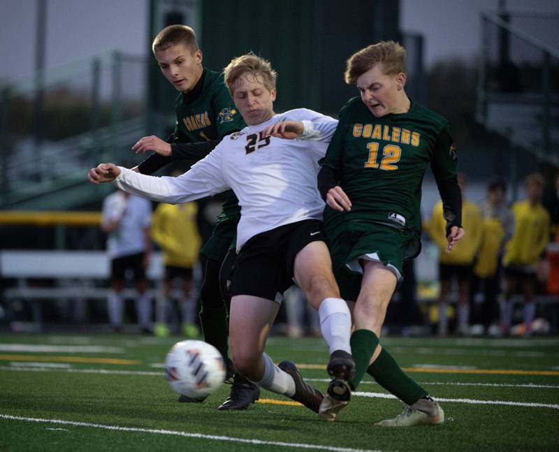 Coal City's Carter Hollis, right, gets a shot on goal off before Herscher's Kanden Venckauskas can interfere during a sectional game on Tuesday, October 28, 2025. Hollis scored on the play.