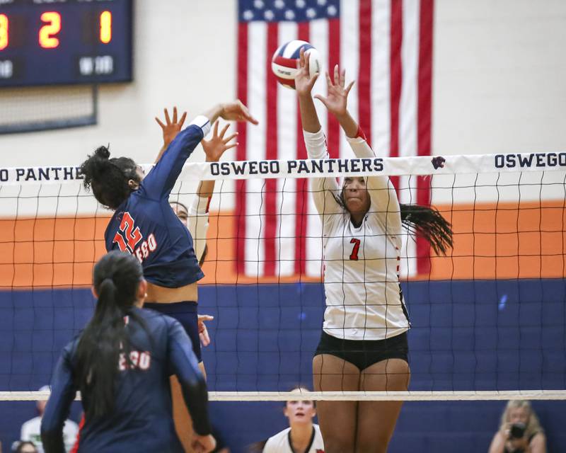 Yorkville's Sophia Blank (7) attempts a block at the net during volleyball match between Yorkville at Oswego. Sept 23, 2025.