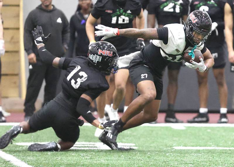 Northern Illinois receiver Keyshaun Pipkin breaks free from cornerback Ty Myles after a catch during the teams first spring practice Wednesday, March 22, 2023, in the Chessick Practice Center at Northern Illinois University in DeKalb.