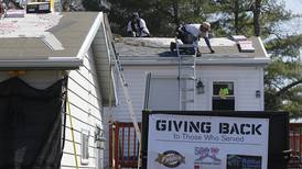 ‘These guys are the best’: Island Lake Army veteran’s roof fixed through effort that helps those who served