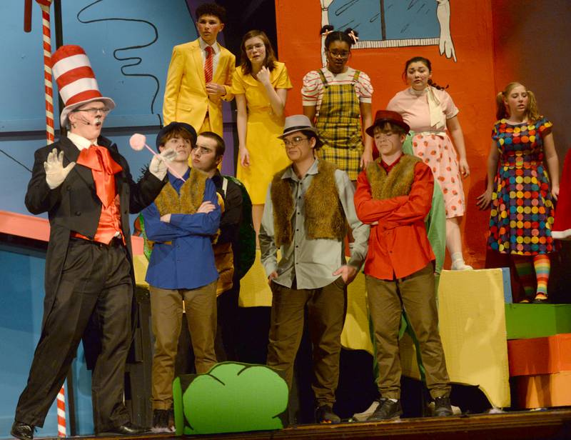 Oregon High School Senior Isaac Ebert performs as The Cat in the Hat while the citizens of Who and the Wickersham Brothers react during the school's presentation of "Seussical The Musical" on Friday, March 14, 2025 in the OHS Theater.