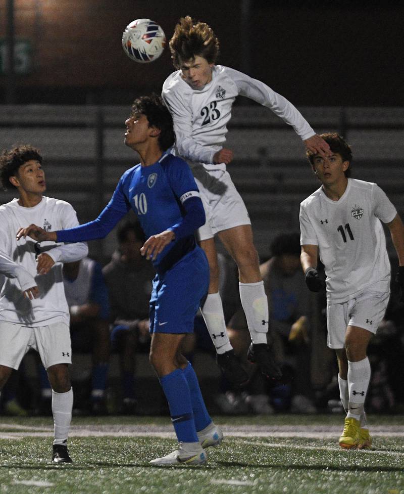 Crystal Lake South’s Brendan Lewis heads the ball over Vernon Hills’ Milan Raval in a Class 2A sectional semifinal boys soccer game in Grayslake on Wednesday, October 26, 2022.