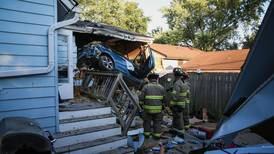 Two flown to hospital with life-threatening injuries after vehicle crashes into Crystal Lake home, garage