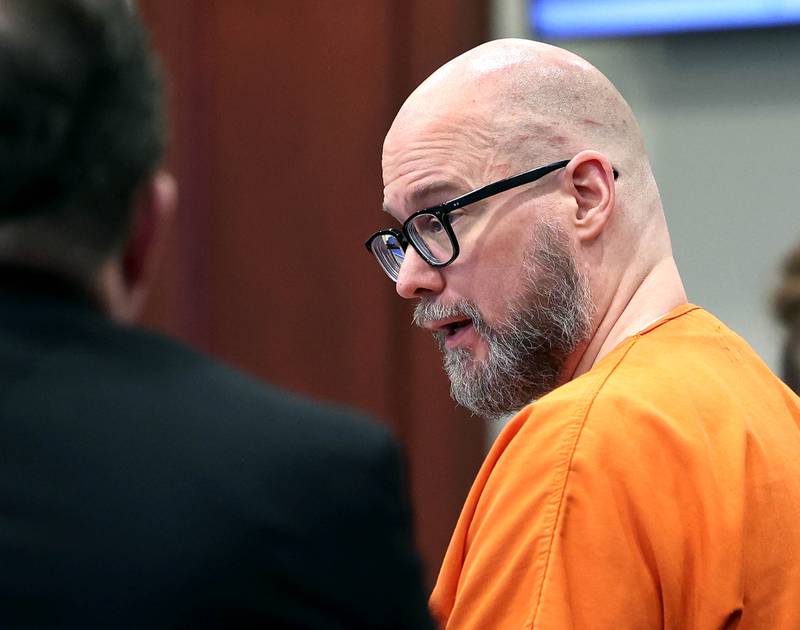 Jonathan D. Hurst, convicted of murdering Sycamore mother and son Patricia and Robert Wilson in 2016, talks to his lawyers after being sentenced to life in prison Thursday, March 20, 2025, at the DeKalb County Courthouse in Sycamore.