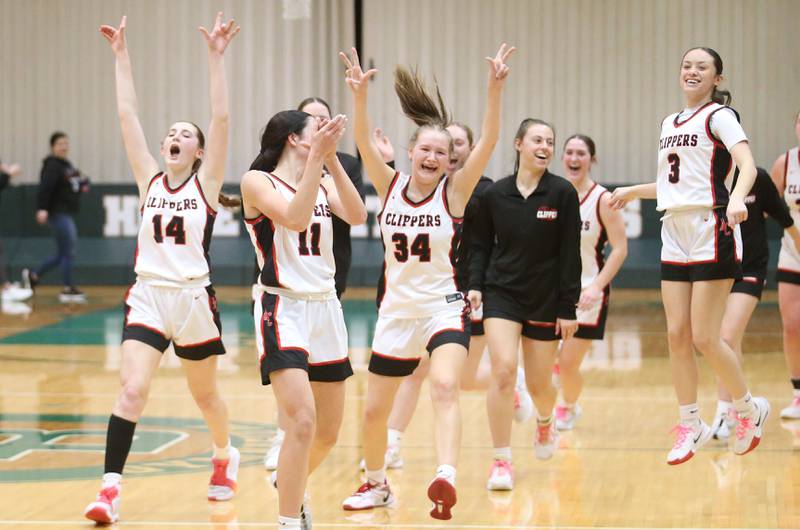 Members of the Amboy/Ohio girls basketball team react after winning the Class 1A Regional championship over Marquette on Thursday, Feb. 20, 2025 at St. Bede Academy.