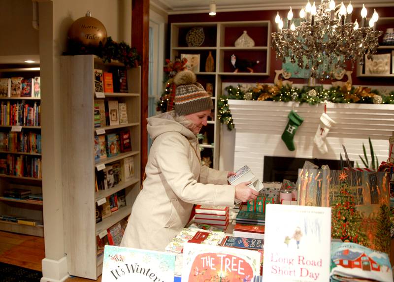 Kate Moore of Sugar Grove shops on Wednesday, Nov. 20 at Harvey’s Tales book shop in Geneva.