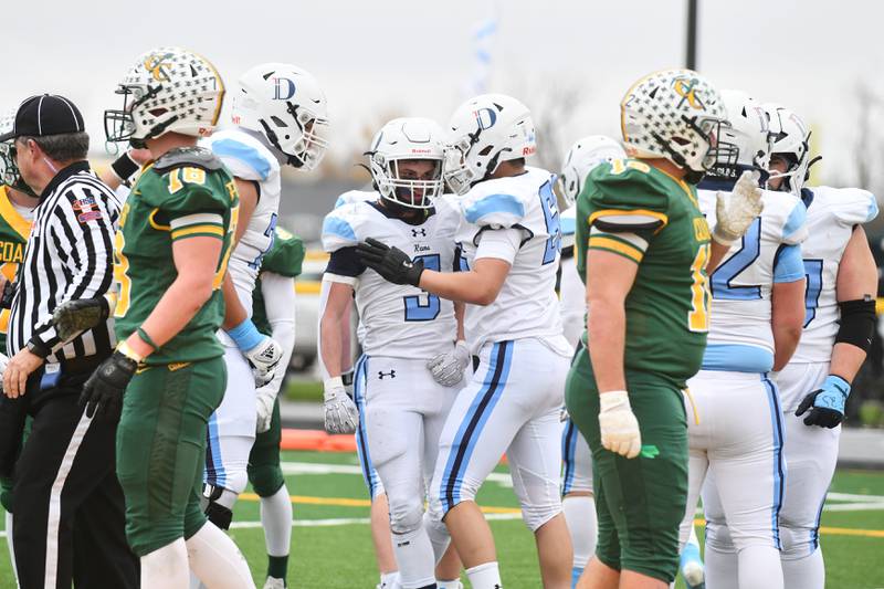 DePaul players celebrate a touchdown by teammate Nick Martinez on Saturday, Nov. 23, 2024, during the Rams' 21-14 victory over the Coal City in the IHSA Class 4A Playoffs semifinal game.