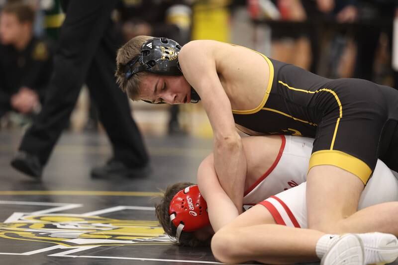 Nicholas Murdock-Schey of Joliet West works over Ramsey Barton of Yorkville in the 106-pound weight SPC Conference championship match at Joliet West on Saturday, Jan 25, 2025.