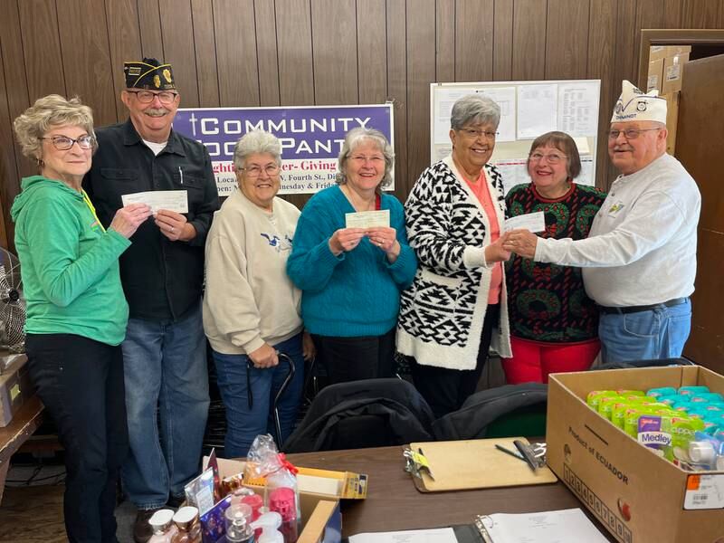 The American Legion Post 12, American Legion Auxiliary and the 40 & 8 donated to the Dixon Food Pantry. From left are Betty Kanzler, treasurer of the food pantry; Mike Barney, American Legion treasurer; Linda Wright, president of the Auxiliary; Jan Barton, treasurer of the Auxiliary; Josie Whaley, vice president of the food pantry; Carol Moss, vice president of the Auxiliary; and Dwight Moss, 40 & 8 Adjunt.