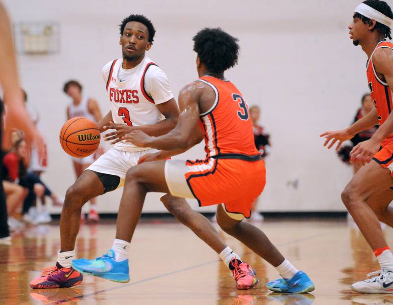 Yorkville's Dayvion Johnson (3) brings the ball down court against the press by Romeoville's Meyoh Swansey during a boys' basketball game at Yorkville High School on Tuesday, Jan. 10, 2023.