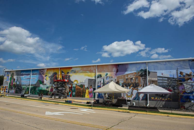 The mural represents 100 years of hispanic culture in Sterling, chronologically from left to right.
