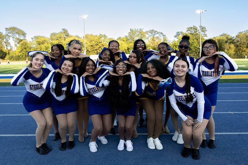 Joliet Central’s varsity dance team poses for a photo before a home football game against Plainfield Central on Sept. 26, 2025.