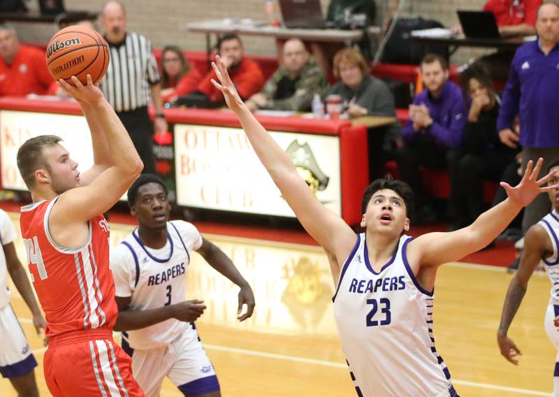 Streator's Nolan Lukach shoots a jump shot over Plano's Isiah Martinez during the Dean Riley Shootin' The Rock Thanksgiving Tournament on Monday, Nov. 20, 2023 at Kingman Gym.