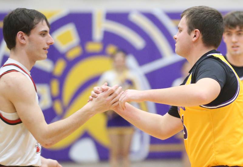Hall's Braden Curran hi-fives Mendota's Grady Jones during the first play of the game on Tuesday, Feb. 3, 2026 at Mendota HIgh School. Jones got the opening pass to start the game.
