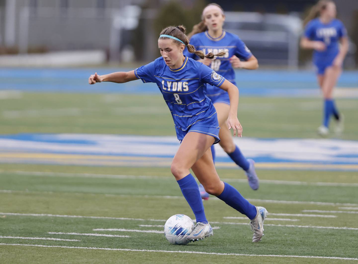 Lyons Township's Caroline Capizzi (8) handles the ball during the girl's varsity soccer match between Lyons Township and Wheaton Warrenville South high schools on Thursday, March 27, 2025 in Western Springs.