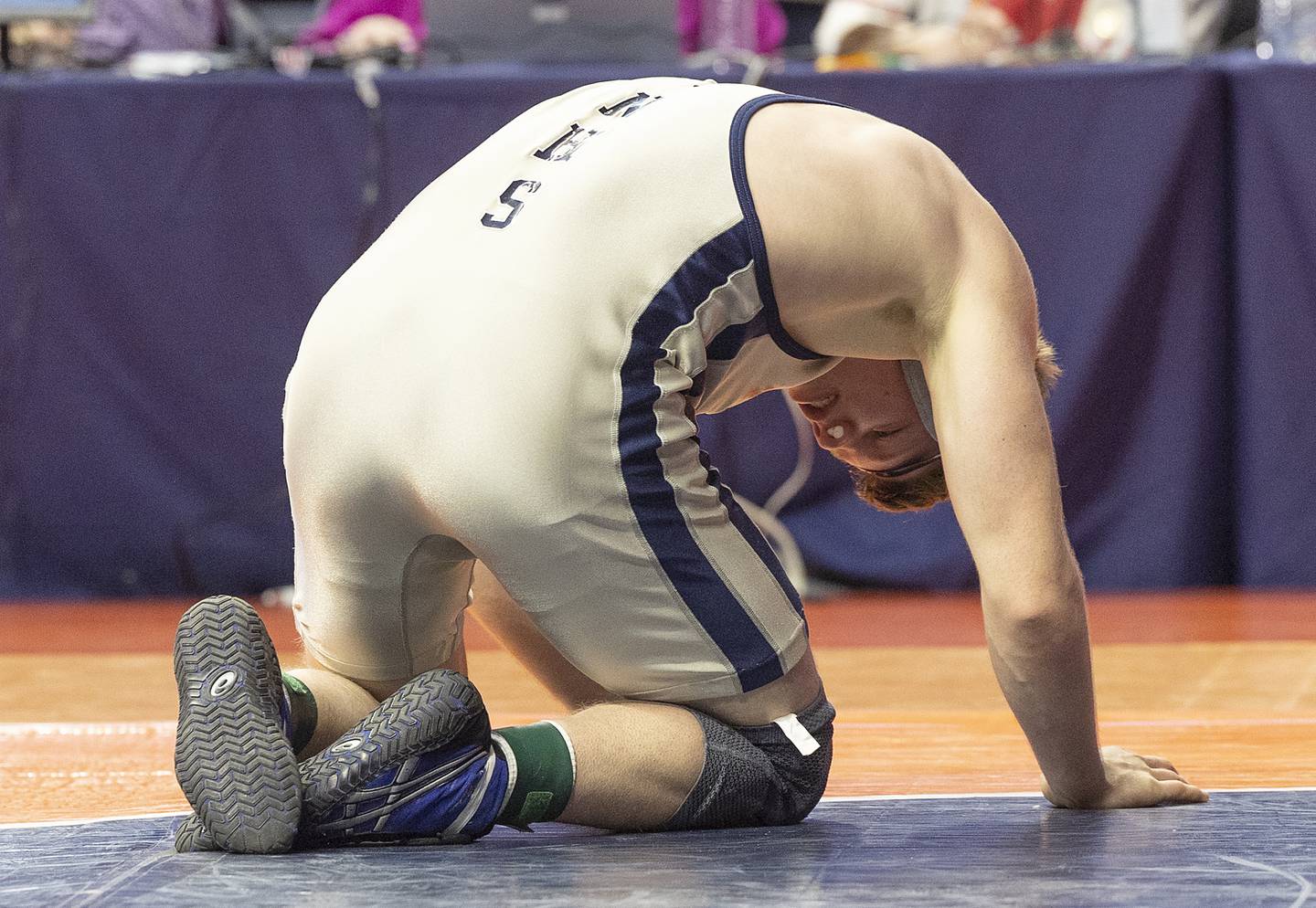 Newman’s Briar Ivey reacts to falling to Riverdale’s Blake Smith in the 157 pound weight class of the 1A state individual wrestling finals Saturday, Feb. 22, 2025, at State Farm Center in Champaign.