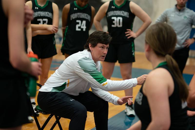 Providence's head coach Eileen Copenhaver talks to her players during the 3A Glenbard South Sectional basketball final against Montini at Glenbard South High School in Glen Ellyn on Thursday, Feb 23, 2023.