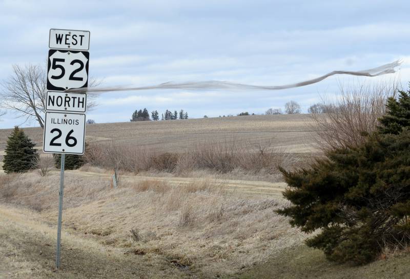 Strong winds continued across the region on Thursday on the heels of a winter storm that included freezing rain. Here, a large piece of plastic blows in the win after being caught on a road sign between Dixon and Polo.