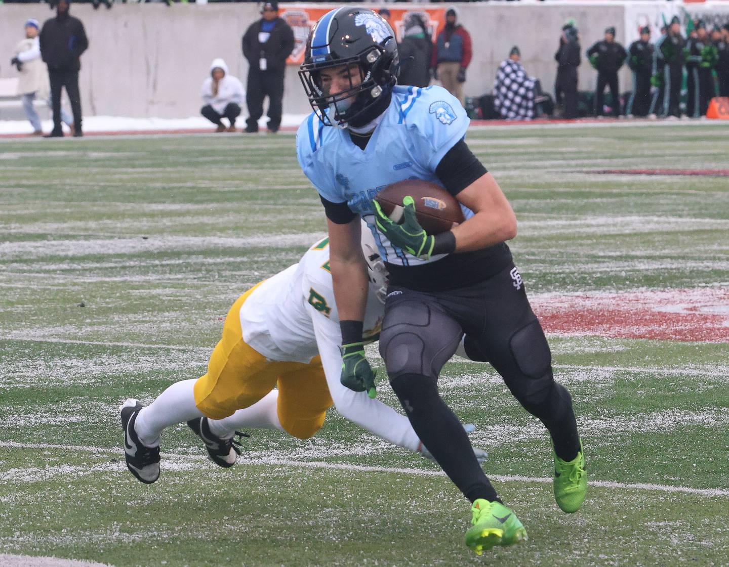 St. Francis's Dario Milivojevic avoids a sack from Providence Catholic's John Fife during the Class 5A State championship on Tuesday, Dec. 2, 2025 in Hancock Stadium at Illinois State University in Normal.