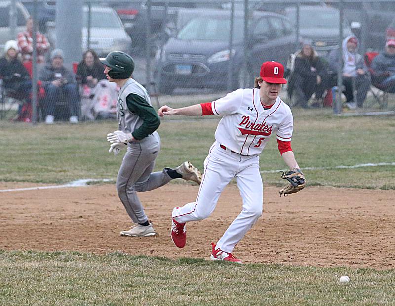 Ottawa's Aiden Mucci runs after a ground ball as St. Bede's Alex Ankieic rounds third base on Wednesday, March 22, 2023 at Ottawa High School.