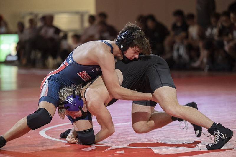 Morrison’s Conrad Eichman and Dixon’s Adam Staples grapple the 165 pound weight class in the Class 1A wrestling sectionals at Oregon.