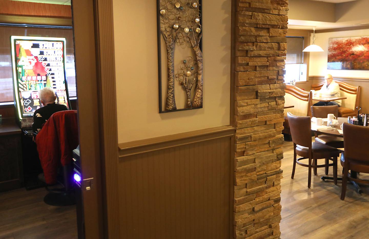 A woman plays a video gaming machine inside 3 Brothers Restaurant on Thursday, Jan. 22, 2026. Woodstock is considering additional regulations surrounding video gaming in the city.