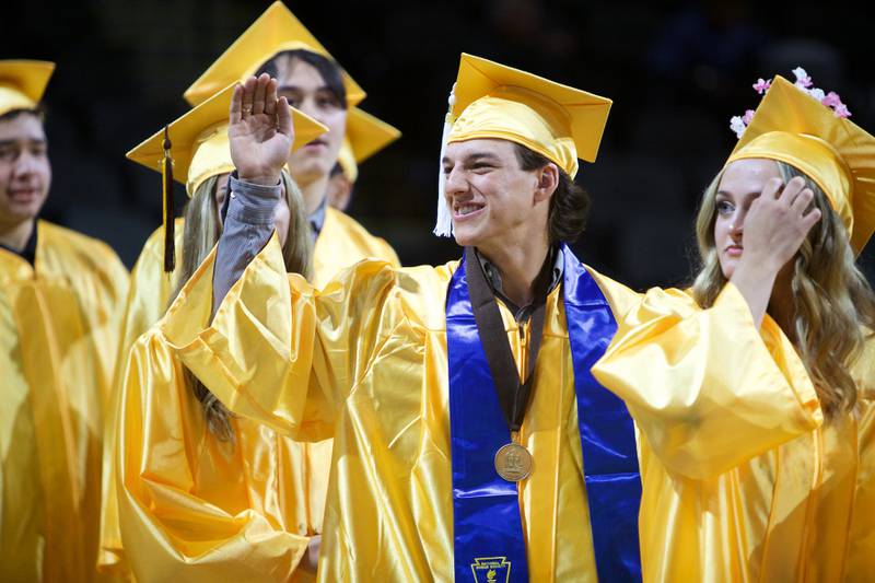 Joseph Fiorenza waves to family before the Jacobs  High School graduation ceremony on May 21, 2022, at the NOW Arena in Hoffman Estates.