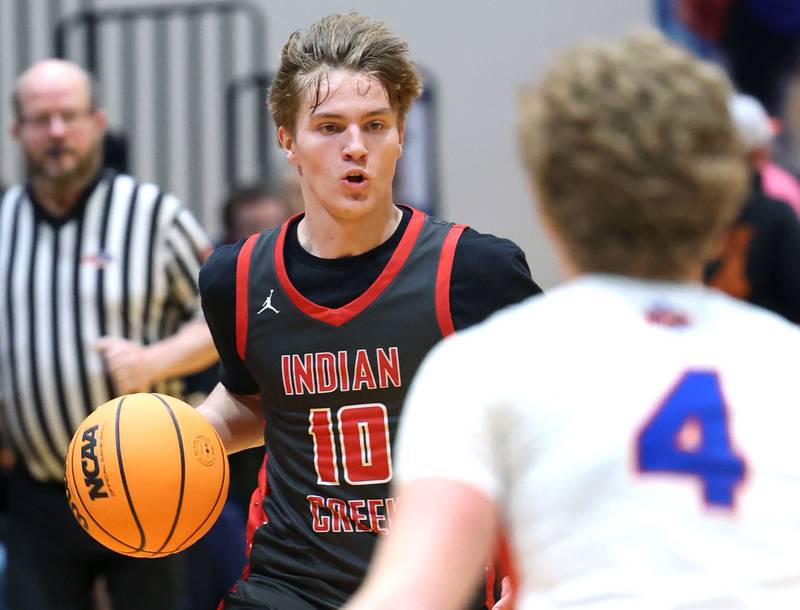 Indian Creek's Parker Murry brings the ball up against Genoa-Kingston's Cody Cravatta during their game Friday, Jan. 2, 2026, at Genoa Kingston High School.