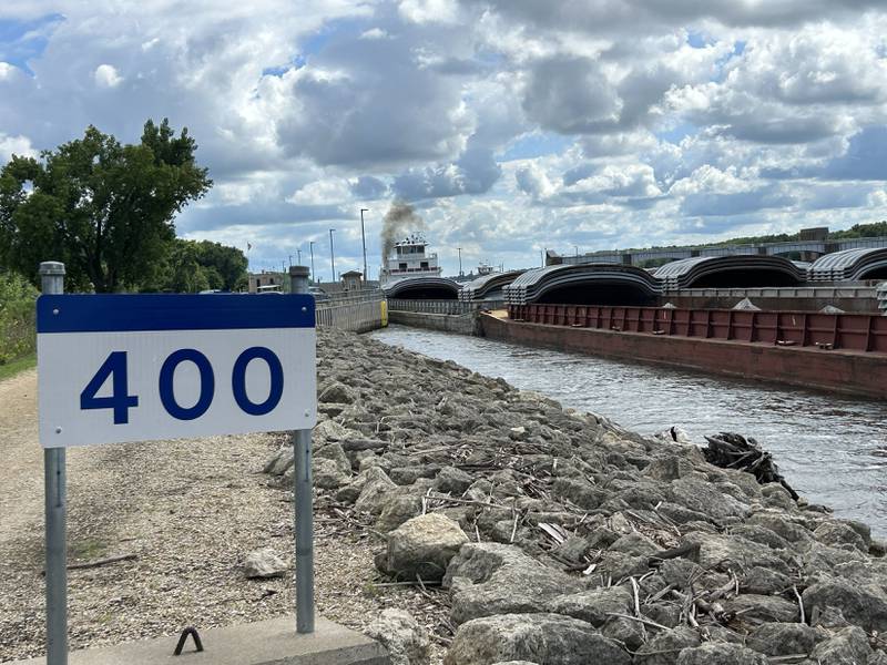 The towboat Neil N Diehl pushes barges up the Mississippi River after passing through the lock at Lock & Dam 13 near Fulton on Sunday, July 6, 2025.