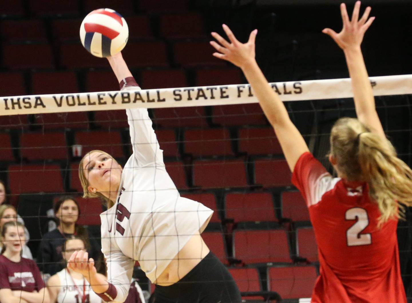 Lockport's Hutsyn Timosciek hits the ball past Marist's Bella Bullington during the Class 4A State semifinal game on Friday, Nov. 15, 2024 at CEFCU Arena in Normal.