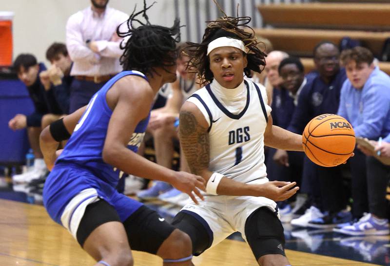 Downers Grove South's Keon Maggitt brings the ball upcourt against Proviso East's Anthony Anderson during their game Friday, Feb. 14, 2025, at Downers Grove South High School.