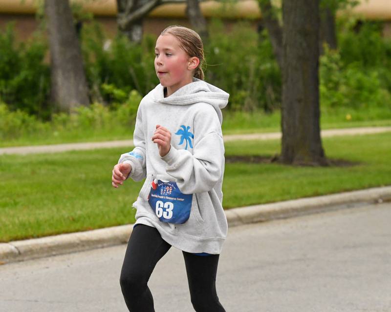 Emma Kavanagh, 10, of Burr Ridge runs during the Race to the Flag 5k and was the third overall woman to finish on Sunday May 25, 2025, held at Ty Warner Park in Westmont.