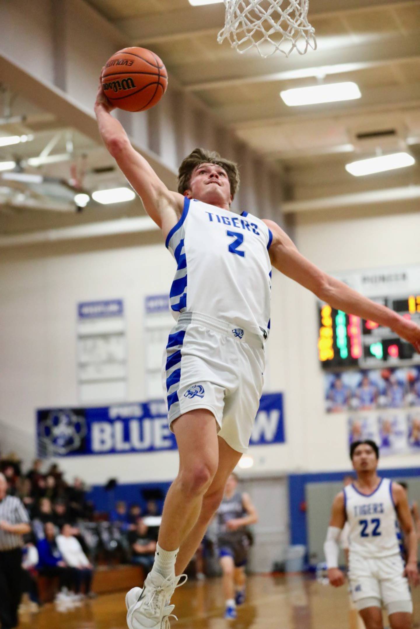 Princeton's Teegan Davis soars for a dunk against Newman Friday night at Prouty Gym. He scored 29 points to lead the Tigers to a 80-32 win.