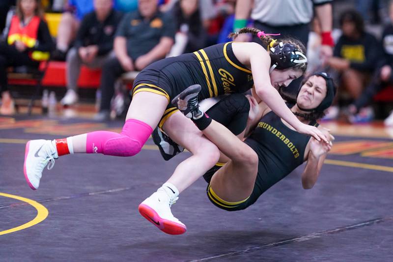 Glenbard North’s Gabby Gomez knocks Andrews’ Sophia Figueroa to the mat during their 115 pound match in the Schaumburg Girls Wrestling Sectional at Schaumburg High School on Saturday, Feb 10, 2024.