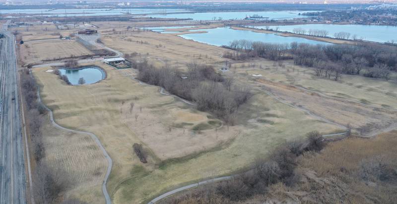 An aerial view of the Lost Marsh Golf Course looking west toward Wolf Lake Memorial Park on Saturday, Feb. 21, 2026 in Hammond, Ind. The Lost Marsh Golf Course near 129th Street and Calumet Avenue, is one of the sites that was evaluated by the Chicago Bears for a potential stadium located about 18 miles southeast of Soldier Field. The golf course was built on a former industrial landfill. Oil refineries and a residential neighborhood are located close to the golf course.