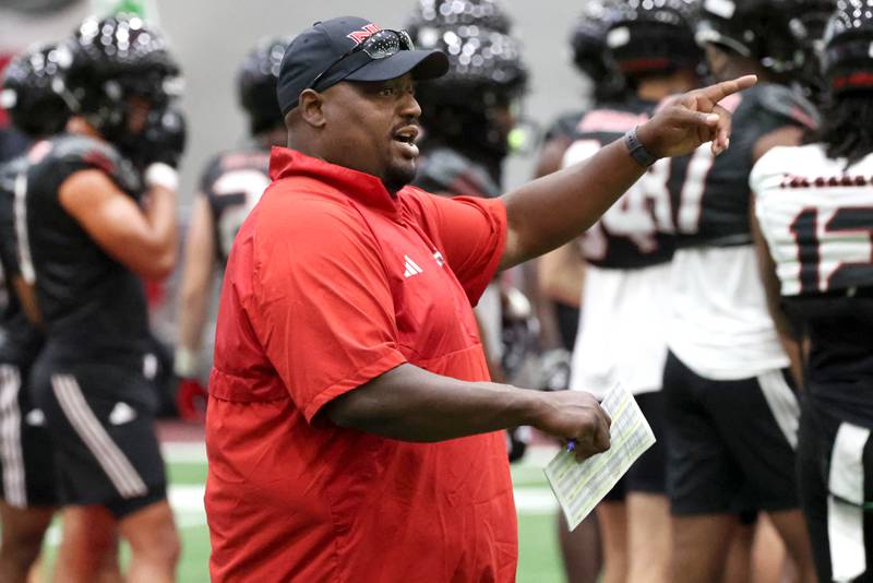 Northern Illinois University football head coach Thomas Hammock instructs his team Wednesday, July 31, 2024, during practice in the Chessick Practice Center at NIU.