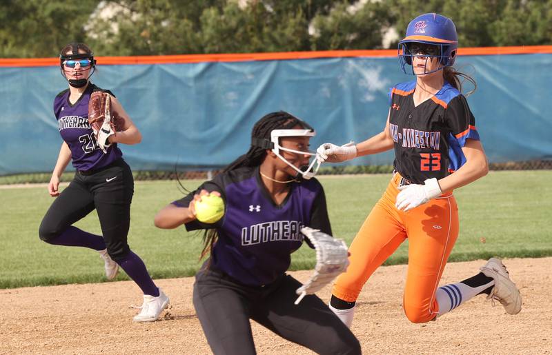 Genoa-Kingston's Faith Thompson runs to third as Rockford Lutheran's Ja'maya Hawkins fields the ball in front of her during their Class 2A Regional quarter final game Monday, May 15, 2023, at Genoa-Kingston High School.