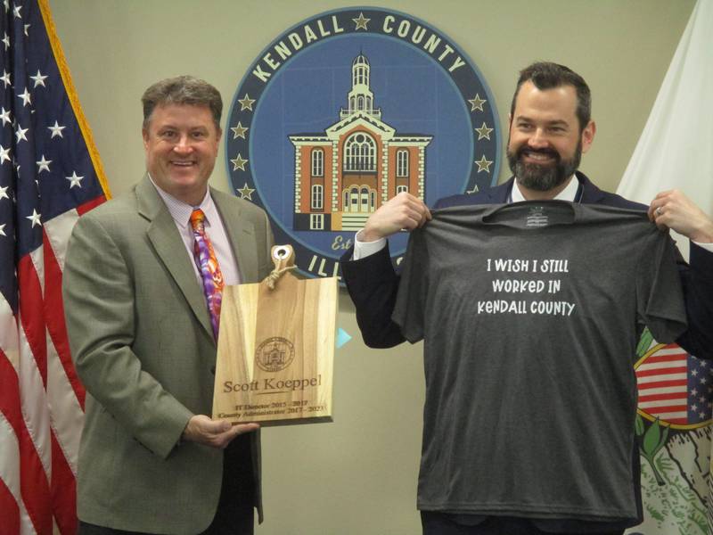 Kendall County Administrator Scott Koeppel, right, was honored by the County Board on April 18, 2023. He has accepted a new post as village administrator for Sugar Grove. Koeppel is seen with County Board Chairman Matt Kellogg.