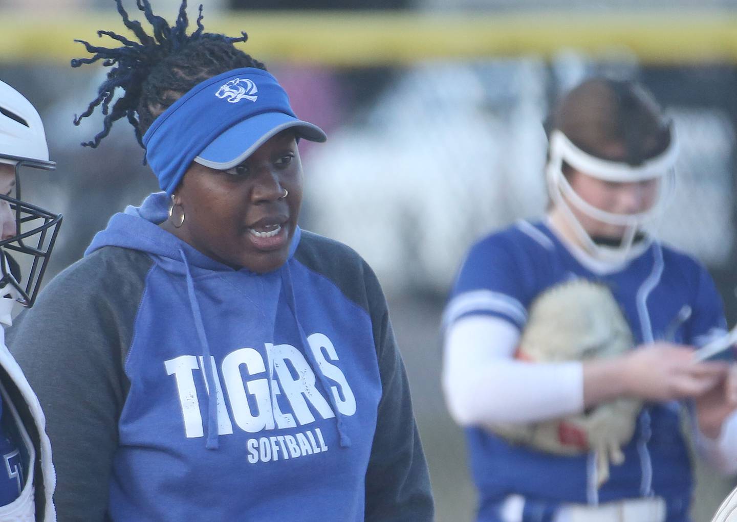 Princeton softball head coach Jhavon Hayes talks to her team on the mound while facing L-P on Tuesday, March 25, 2025 at the L-P Athletic Complex in La Salle.