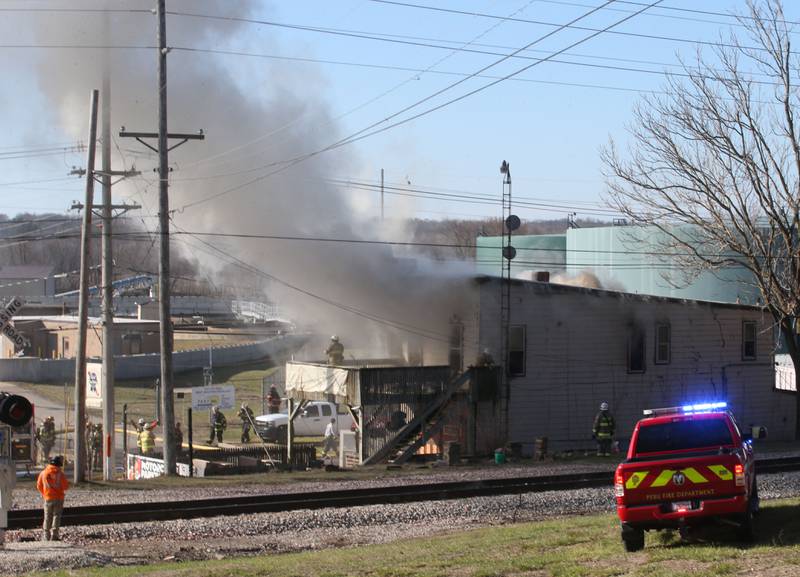 Smoke billows out from the former Platform 31 tavern on Monday, March 24, 2025 on Water Street in Peru. The fire was upgraded to a three-alarm summing ire departments from La Salle, Utica, Mendota, Spring Valley, Tonica, Ottawa, Ladd, Lostant, Cedar Point, Troy Grove and Peru responded to the fire.