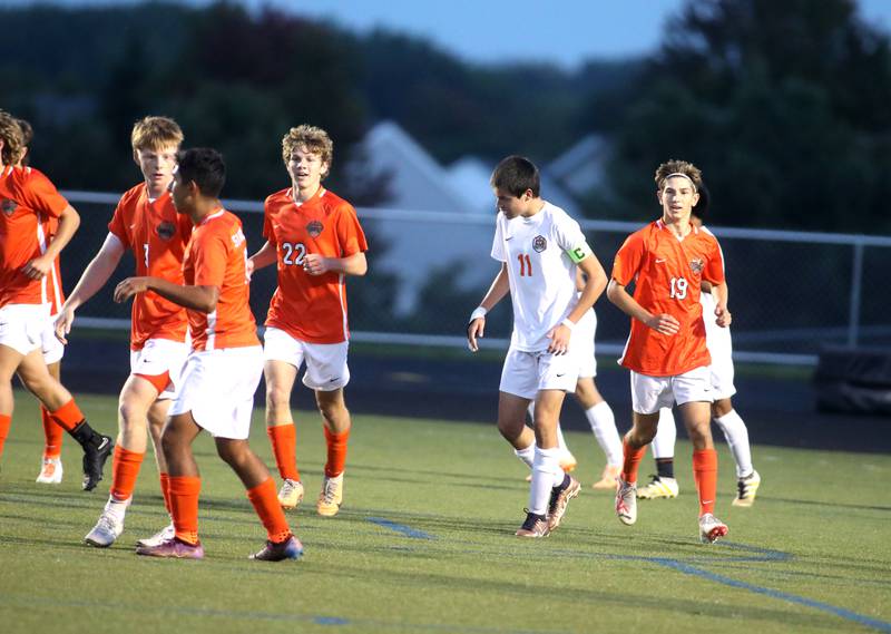 St. Charles East players celebrate teammate Ryan Groselak’s (19) goal during a game against Crystal Lake Central at Streamwood on Tuesday, Sept. 12, 2023.