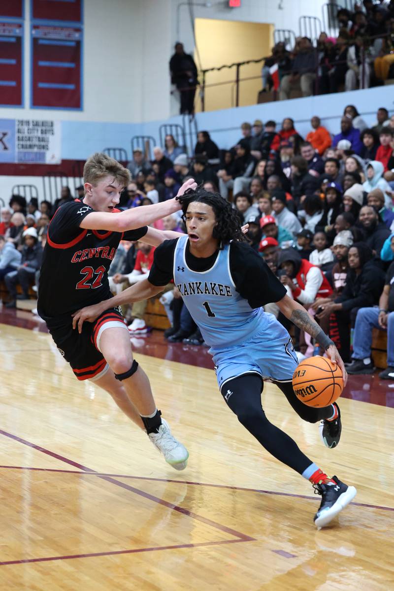 Kankakee's Lincoln Williams drives against Lincoln-Way Central's Nick Brzezniak during the Kays' 54-50 victory over Lincoln-Way Central in the 75th Kankakee Holiday Tournament maroon bracket championship on Sunday, Dec. 28, 2025.