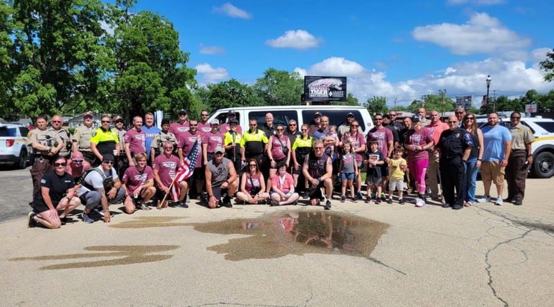 Participants pose for a photo during the 2024 Law Enforcement Torch Run for Special Olympics Illinois.