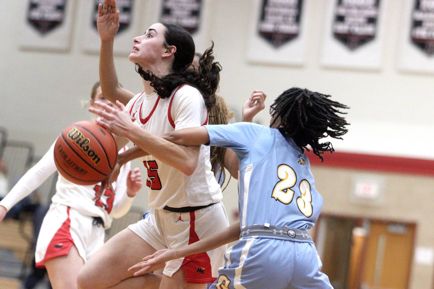 Huntley’s Jessie Ozzauto navigates through heavy traffic during IHSA Class 4A Regional title game action against Rockford Guilford at Huntley on Friday.
