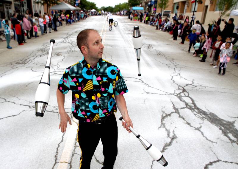 Juggler Aaron Henning of Milwaukee performs during the Harvard Milk Days parade Saturday, June 4, 2022, in Harvard.