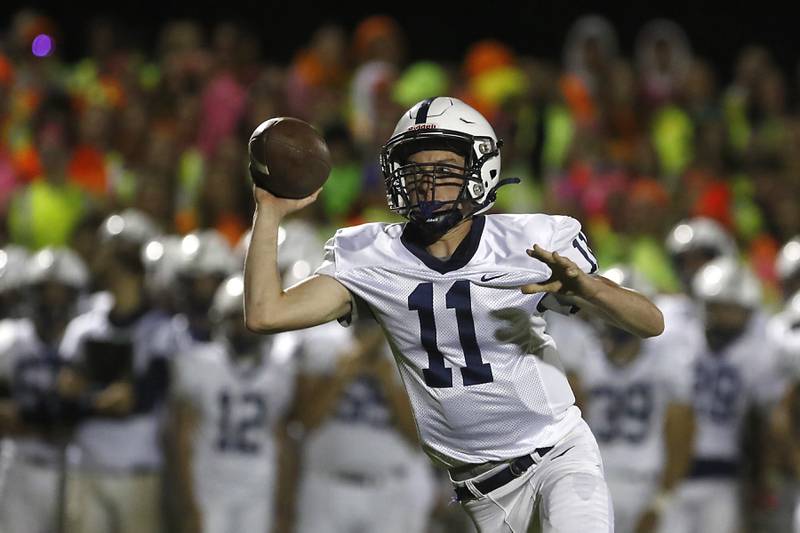 Cary-Grove's Payton Seaburg fakes a pass as he runs with the ball during a Fox Valley Conference football game between Prairie Ridge  and Cary-Grove Friday, Sept. 23, 2022, at Prairie Ridge High School in Crystal Lake.