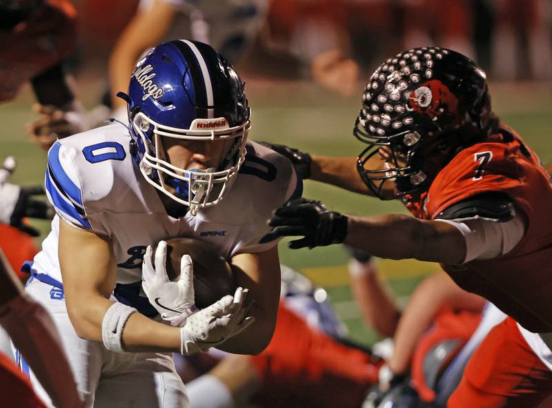 Riverside Brookfield's Jacob Retana (0) runs for a touchdown during the varsity football game between Riverside Brookfield and Glenbard East on Friday, Oct. 24, 2025 in Lombard, IL.