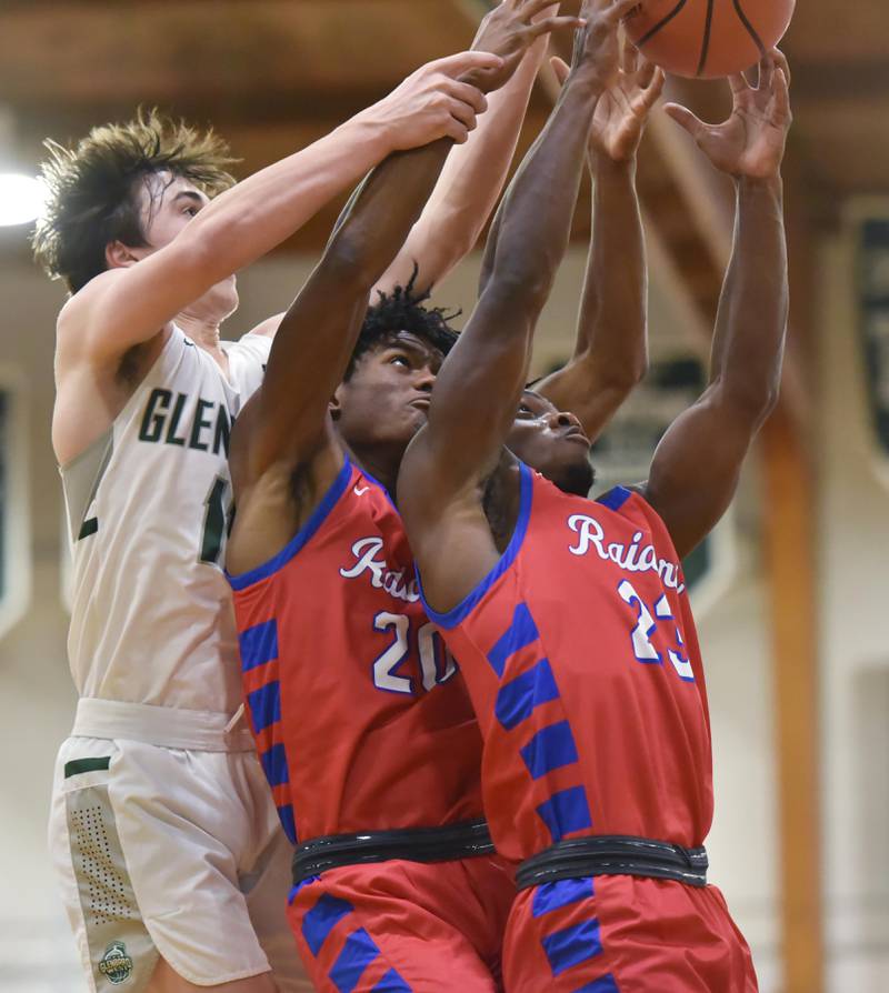 John Starks/jstarks@dailyherald.com
Glenbard South’s Jalen Brown gets the rebound against his teammate Cam Williams and Glenbard West’s Logan Brown in a boys basketball game in Glen Ellyn on Monday, November 21, 2022.